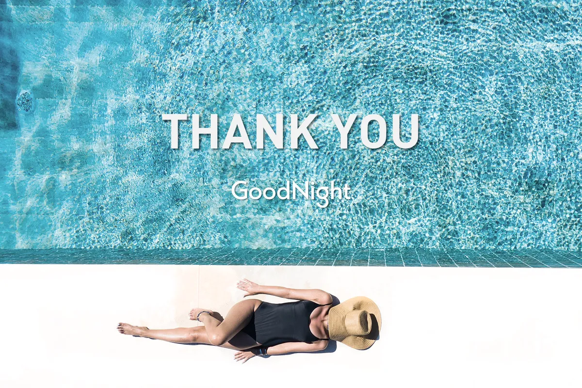 A serene scene of the property's swimming pool, with a person lounging poolside and a subtle text overlay. The pool area is surrounded by landscaping, creating a peaceful retreat for relaxation and enjoyment in any season.